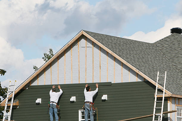 Professional Siding Installation technician working in Arlington, TN